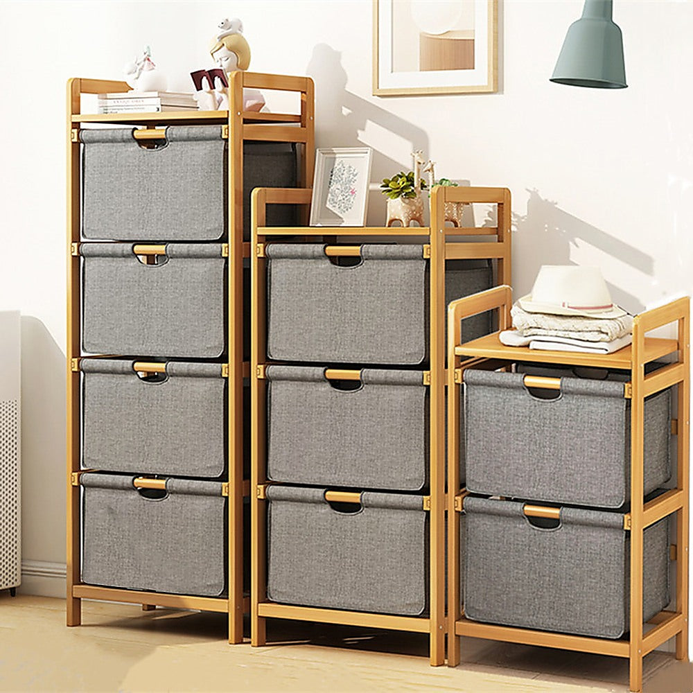 A stylish bamboo and rigid cloth look storage unit with nine cube shaped draws ina bedroom or lounge setting.